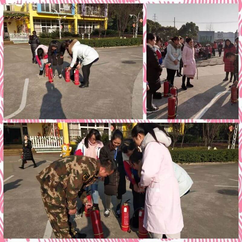教师在消防员的指导下学习灭火器的正确使用